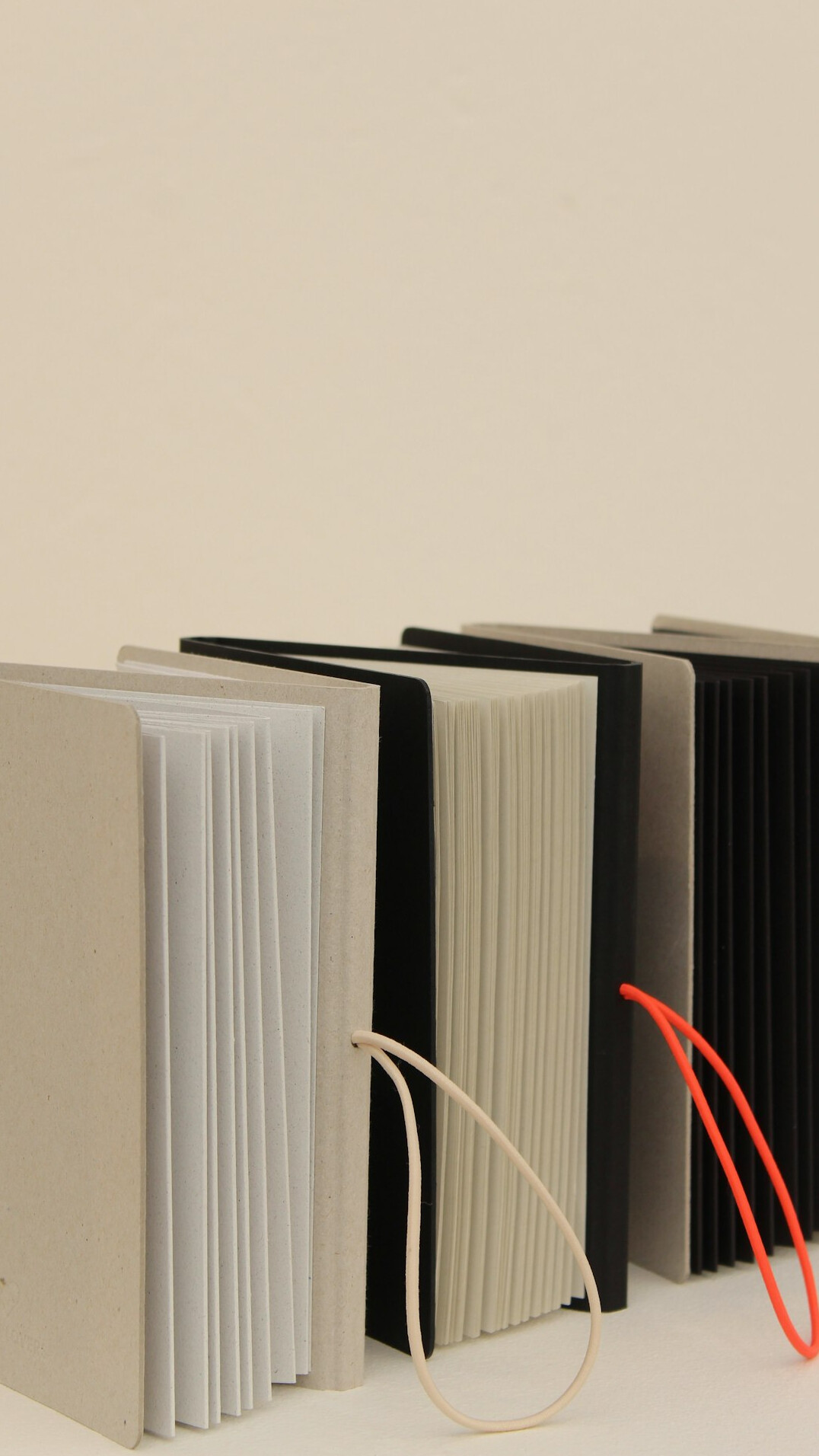 Stack of old case folders tied with string on an archive table